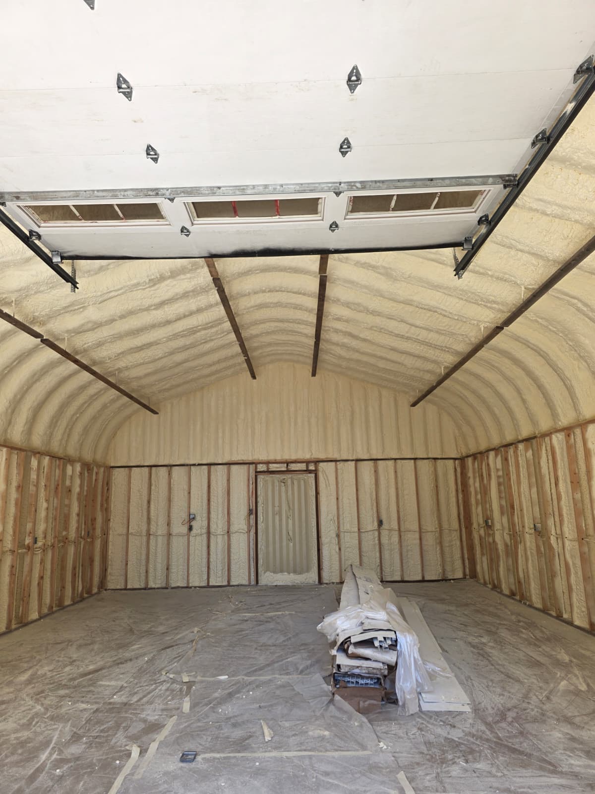 Quonset hut interior fully insulated with closed-cell spray foam — AT Foam Seattle